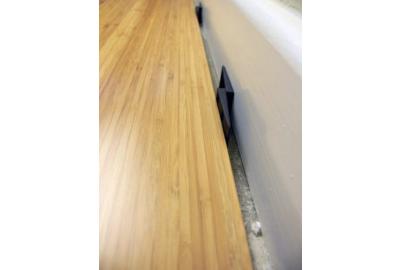 Carbonised Vertical Bamboo Flooring with an expansion gap