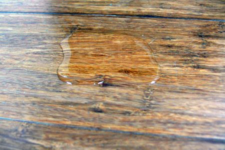 Close up of water spillage on bamboo flooring